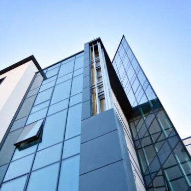 The windows of a modern building for offices. Business buildings architecture.